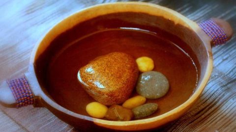 Stones in broth in a soup bowl