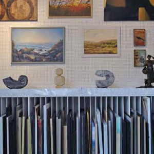 Framed wall prints and slotted frame storage.