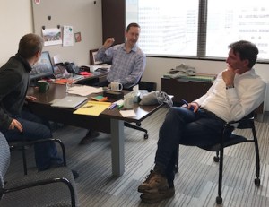 Rob Stein, Josh Morin and Harry Verwayen talking impact in AAM's offices.