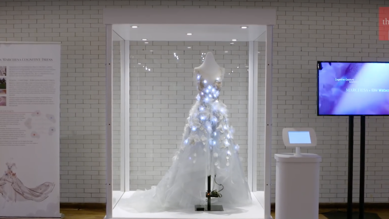 digital dress in a case with a tv screen to the left side.