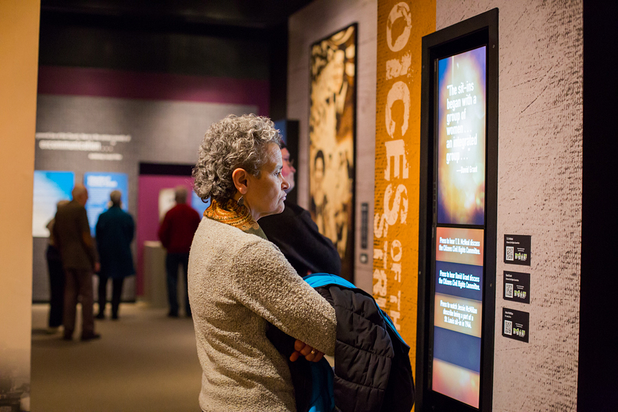 Woman reading a text panel