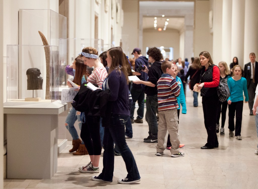 Student visitors to museum in gallery 240; Classical Greece and Rome gallery; temporary installations of African Art