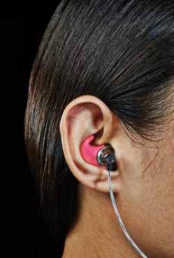 Images of three different people with customized ear buds in their ears