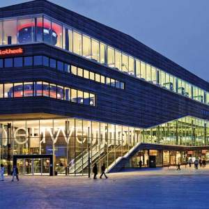 A very modern looking building with lots of lights