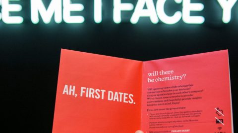 Mi I Face Ah, First Dates written on a card being held by someone