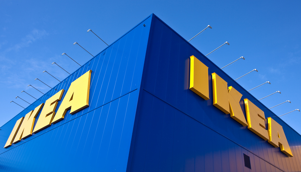 An image of IKEA's blue building with a bright blue sky.
