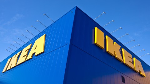 An image of IKEA's blue building with a bright blue sky.