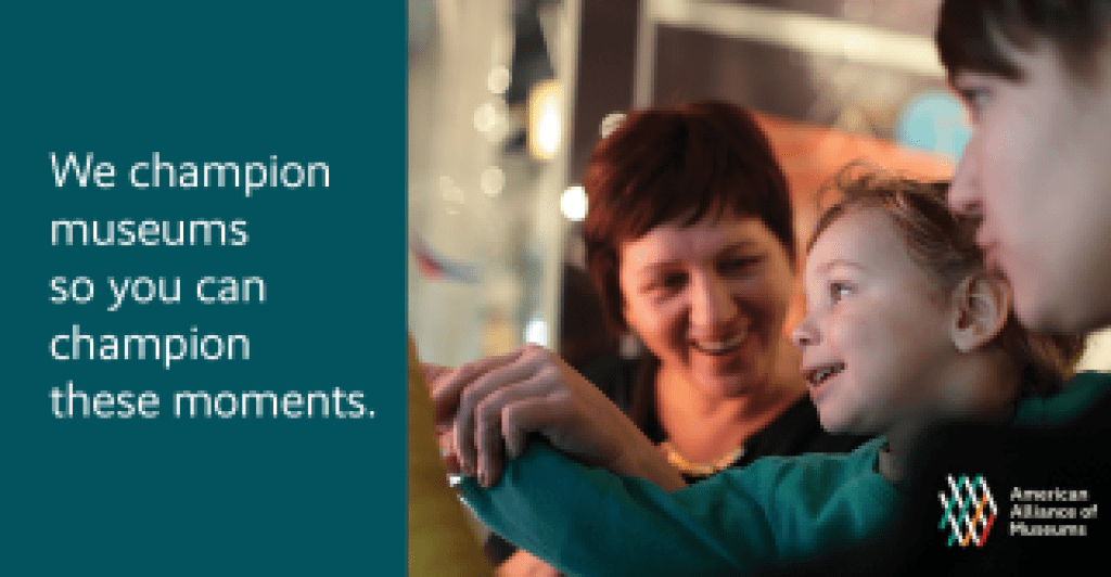Photo of two children with a woman looking at a museum display. Text reads "We champion museums so you can champion these moments."
