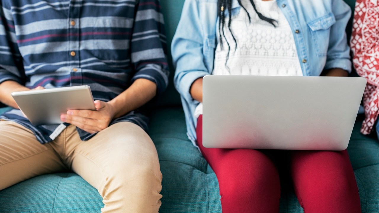 Cropped man and woman using electronic device free image