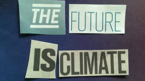 Image of four newspaper clippings with the words "The Future is Climate" laid on a blue background.