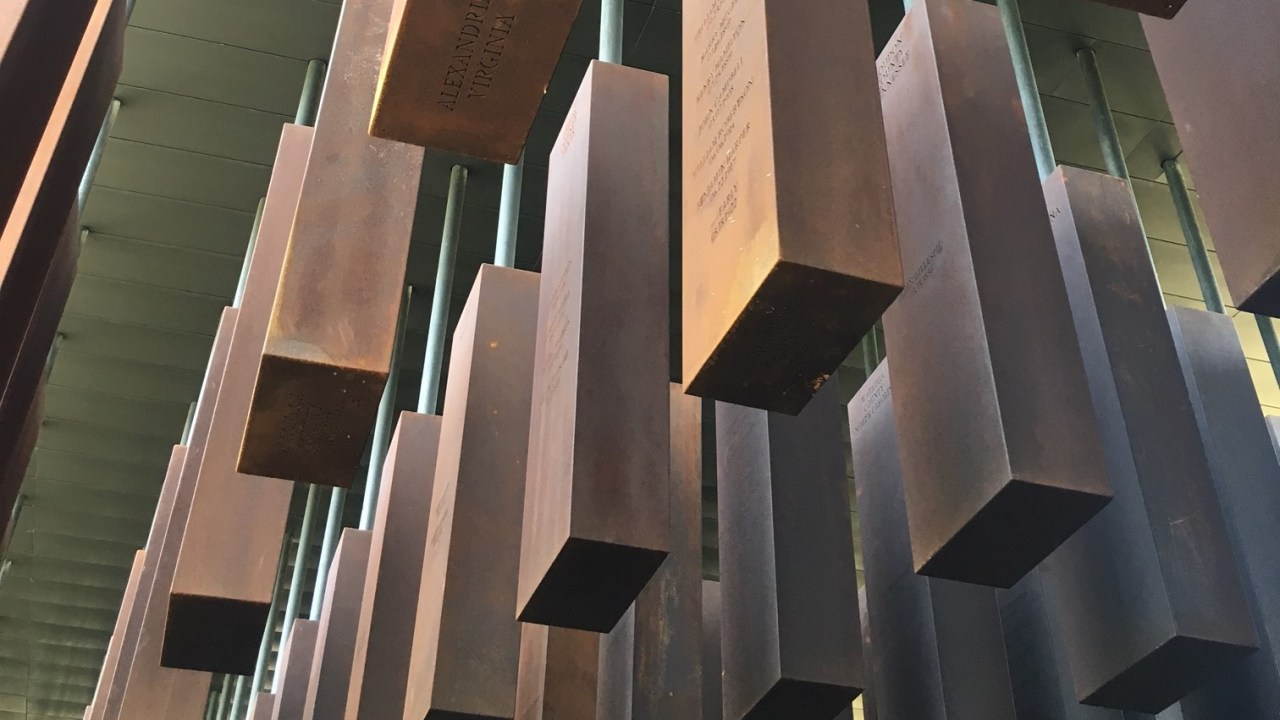 National Memorial for Peace and Justice shot taken from below the hanging memorial markers. Markers are made of copper.