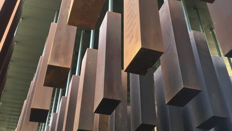 National Memorial for Peace and Justice shot taken from below the hanging memorial markers. Markers are made of copper.