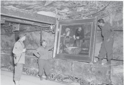 View of several soldiers viewing the Edouard Manet’s Wintergarden in the Merkers salt mine, April 1945.