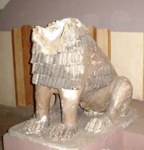 View of a terra-cotta lion without its head. 