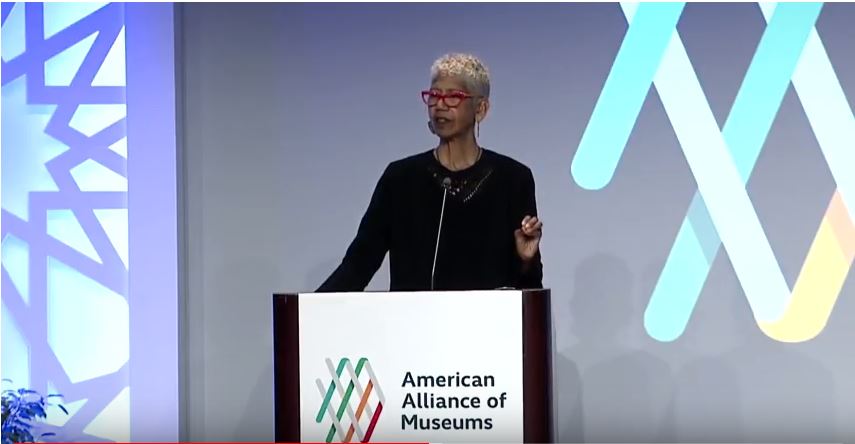 Image of Erica Huggins on stage at the AAM Annual Meeting in Phoenix, AZ
