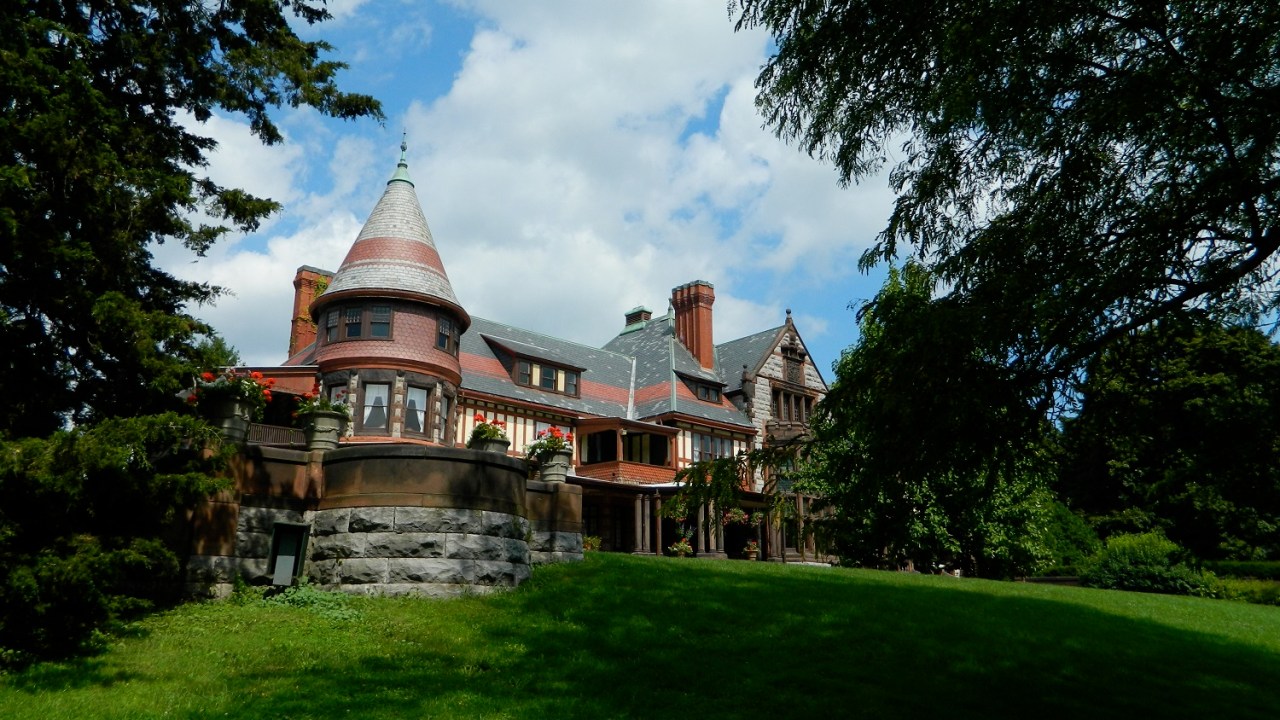 Exterior of a brick Victorian era mansion.