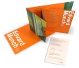 View of an invitation to the Edvard Munch exhibition opening in oranges and greens. 