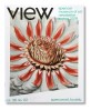 View of the front cover of the View newsletter with an open white flower with red petals in the center. 