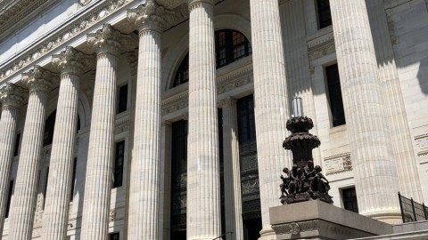 Angled image of a classic style facade with a columned entrance.