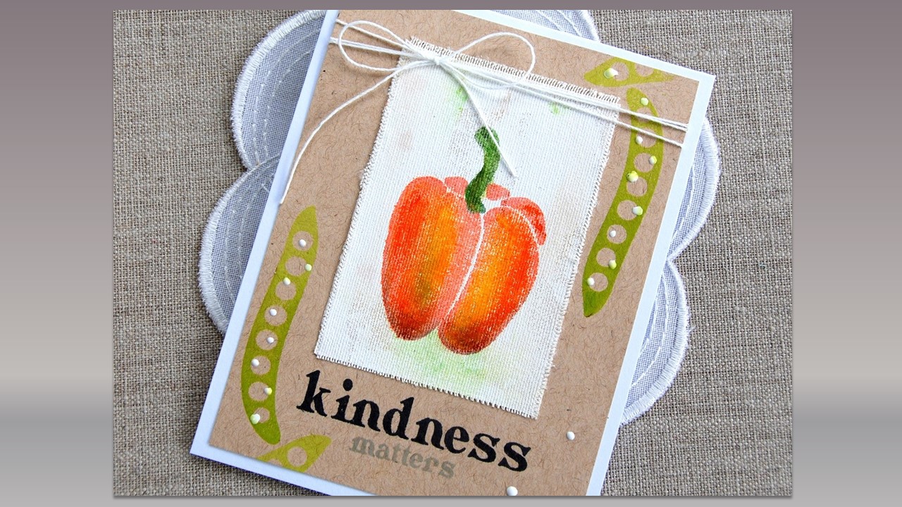 View of a notecard with a drawn red pepper, and two pea pods laying on a white doily on a burlap background.