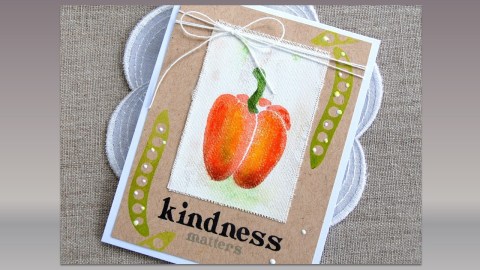 View of a notecard with a drawn red pepper, and two pea pods laying on a white doily on a burlap background.