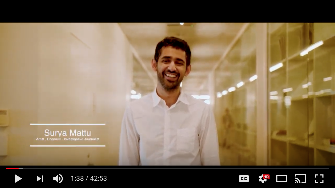 A man, Surya Mattu, smiles at the camera during the introduction to the video.