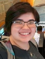 A smiling portrait of Kathren Lee, a staff member at the Museum of Science and Industry in Chicago and leader of the CAMPout group.