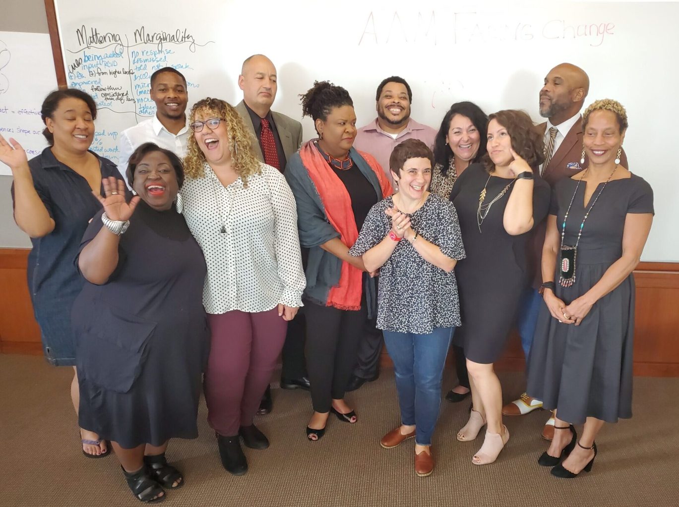 A candid photo of the 10 Senior Diversity Fellows and the two DEAI Project Manager