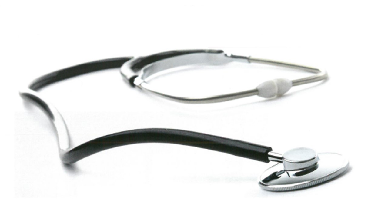 Image of a stethoscope laying against a white background.