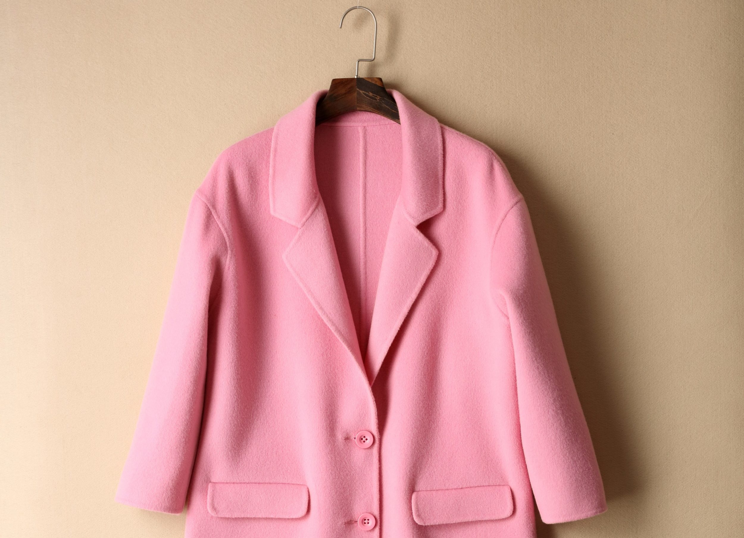 A pink coat on a hanger