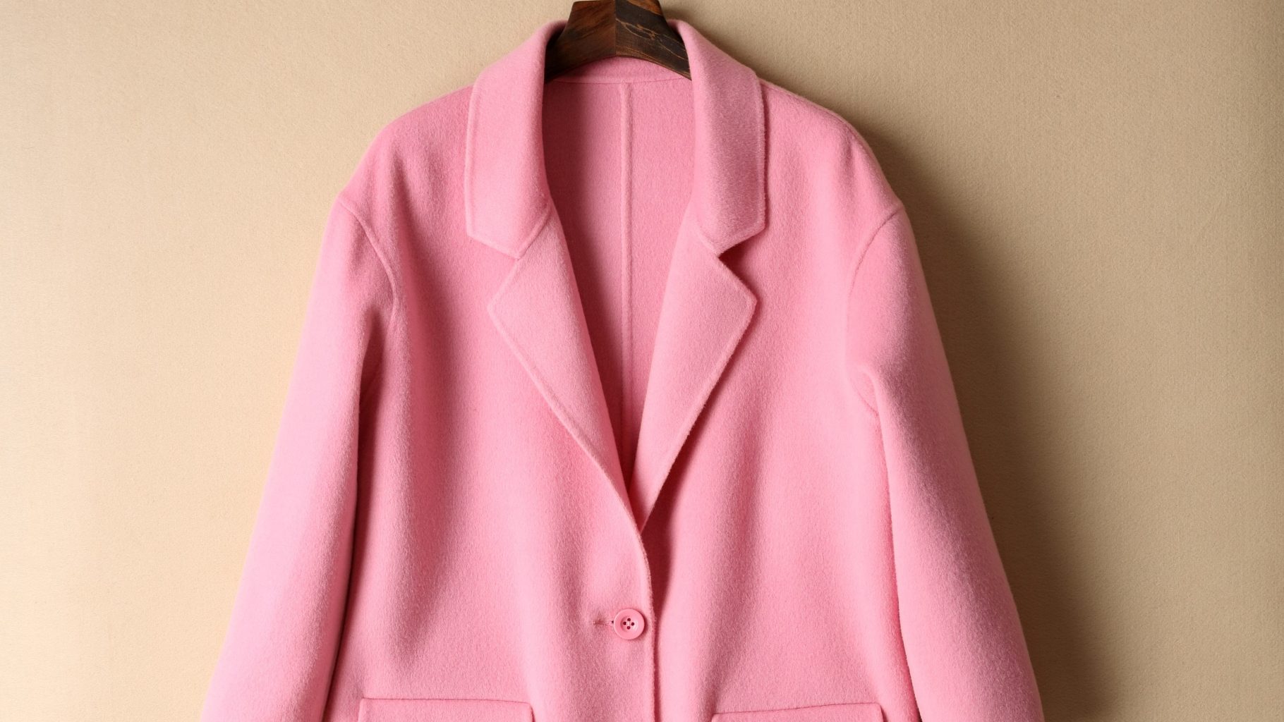A pink coat on a hanger