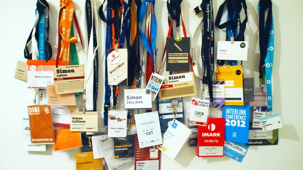 A line up of many of the badges given to conference attendees.