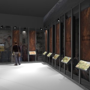 A visitor looks at a display of photos of Kurdish people.