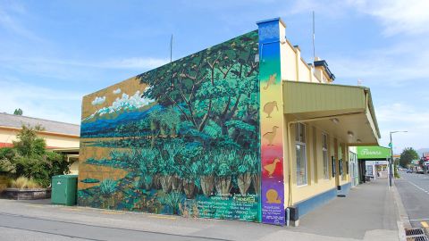 A mural painted on the side of a building.