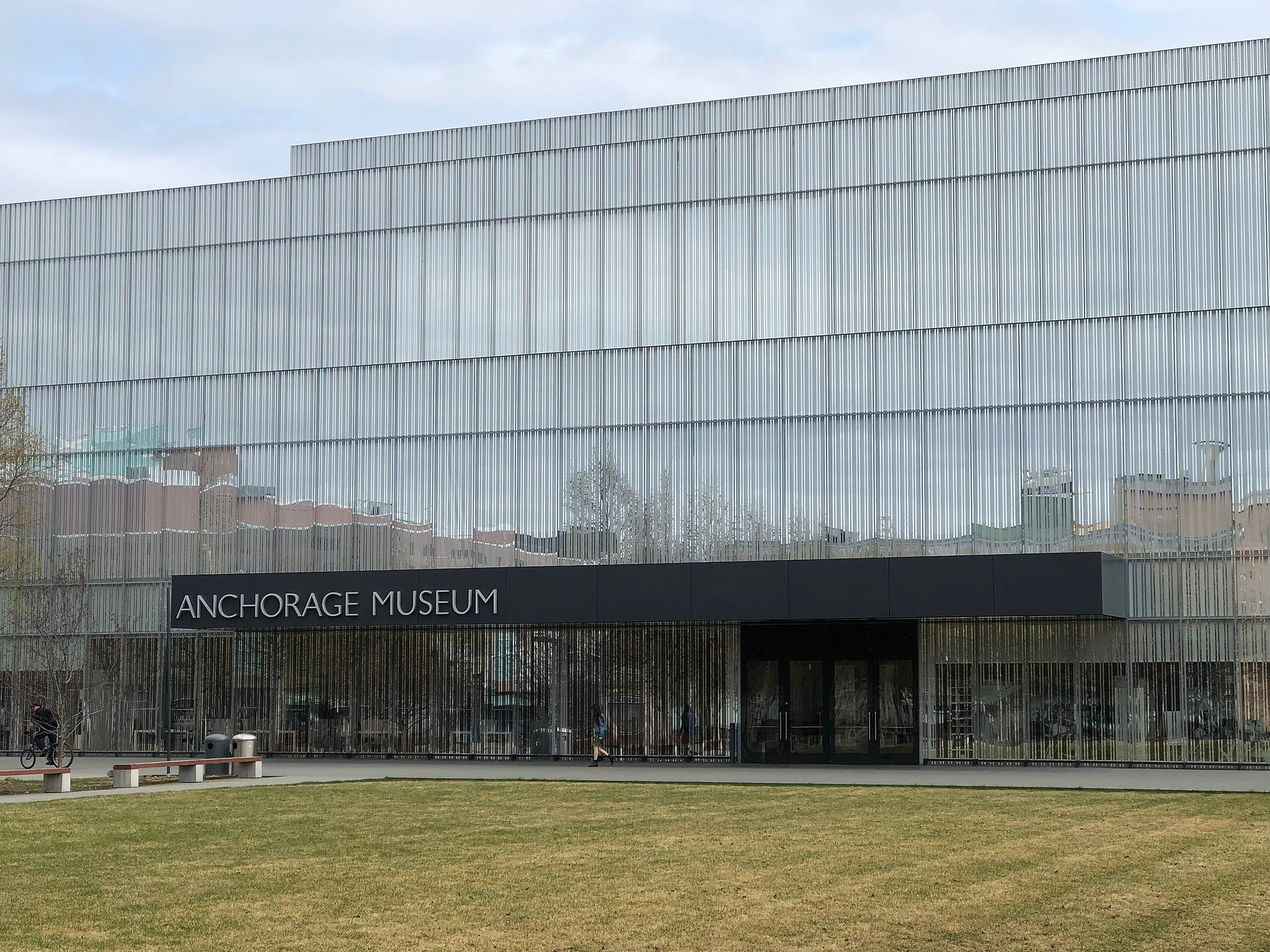 The facade of the Anchorage Museum, with lawn space visible.