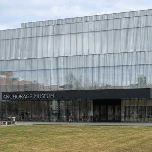 The facade of the Anchorage Museum, with lawn space visible.