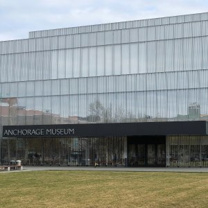 The facade of the Anchorage Museum, with lawn space visible.