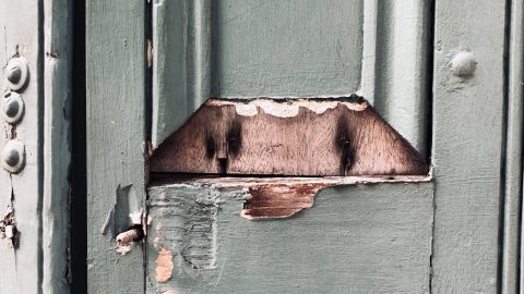 A door with peeling paint