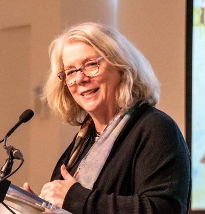 Photo of Nanette V. Maciejunes standing at a podium