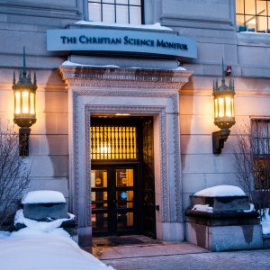 An exterior of an office building labeled with the name of the Christian Science Monitor