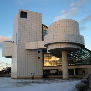 Facade of a modernist museum building at dusk.