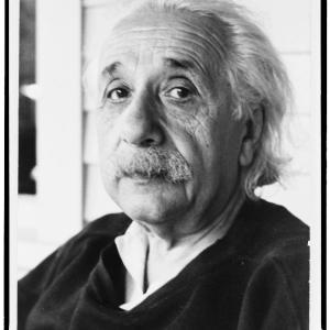 A black-and-white head-and-shoulders portrait of Albert Einstein in old age.