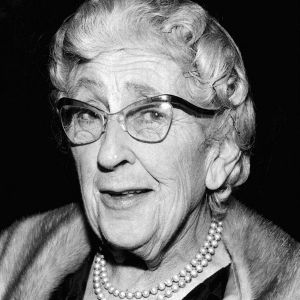 A black-and-white head-and-shoulders portrait of Agatha Christie in old age.