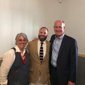 A portrait of three people.