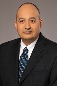 Headshot of Eric J. Carpio