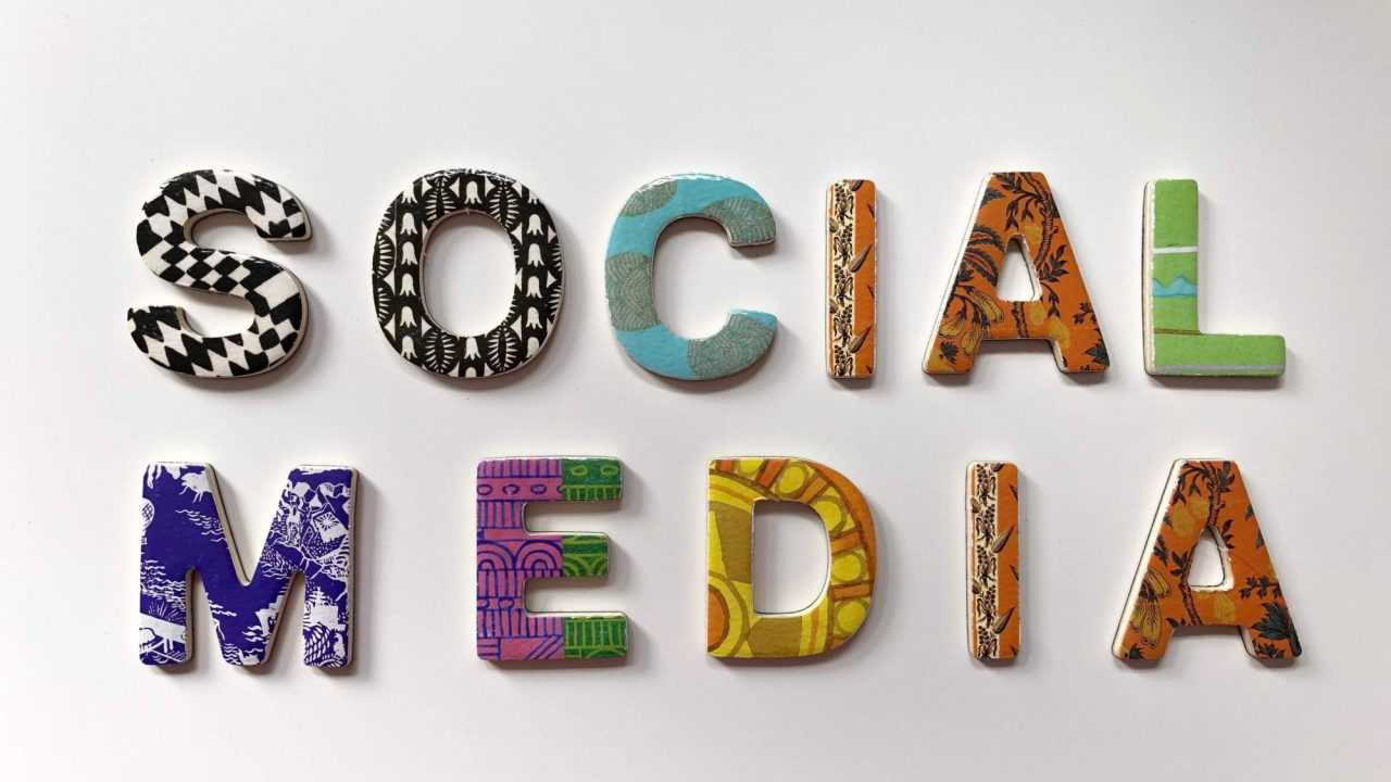 3-D shapes in different patterns spelling out the words "social media."