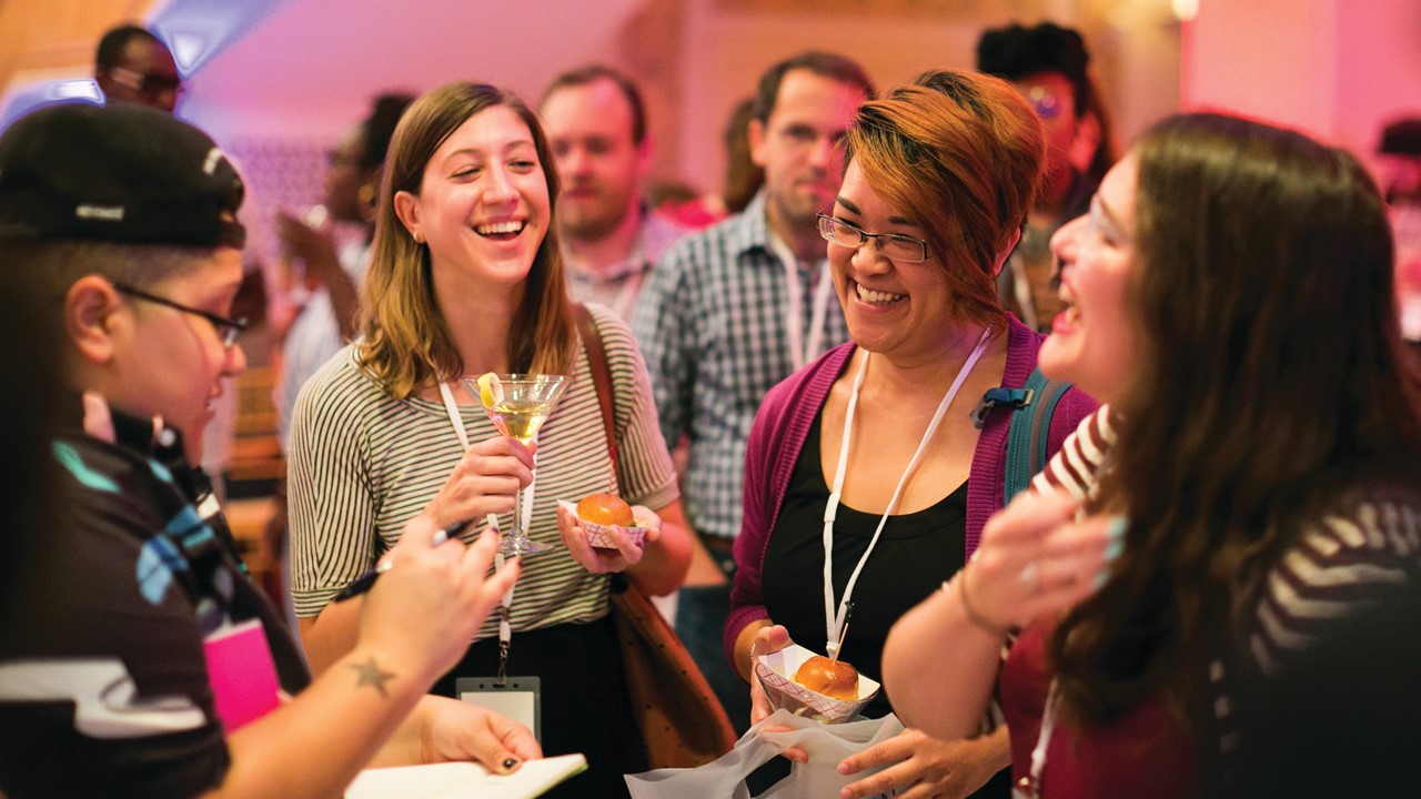 A group of people drinking and smiling.
