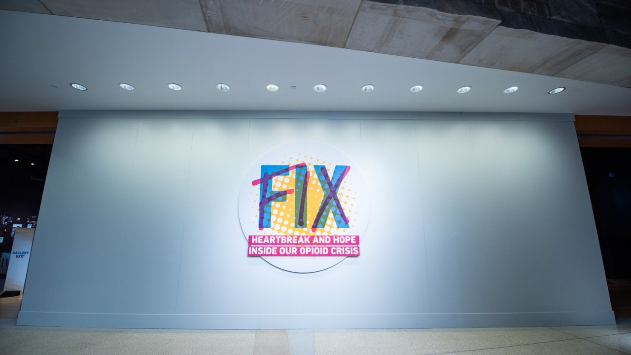 A wall with a sign that says "FIX: Heartbreak and hope inside our opioid crisis"