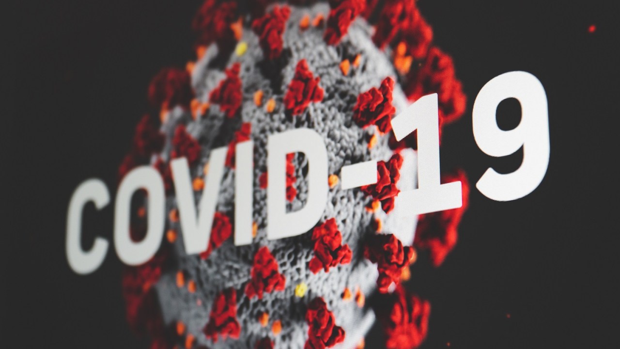 Abstract view of the COVID-19 coronavirus red bloom with white ball.