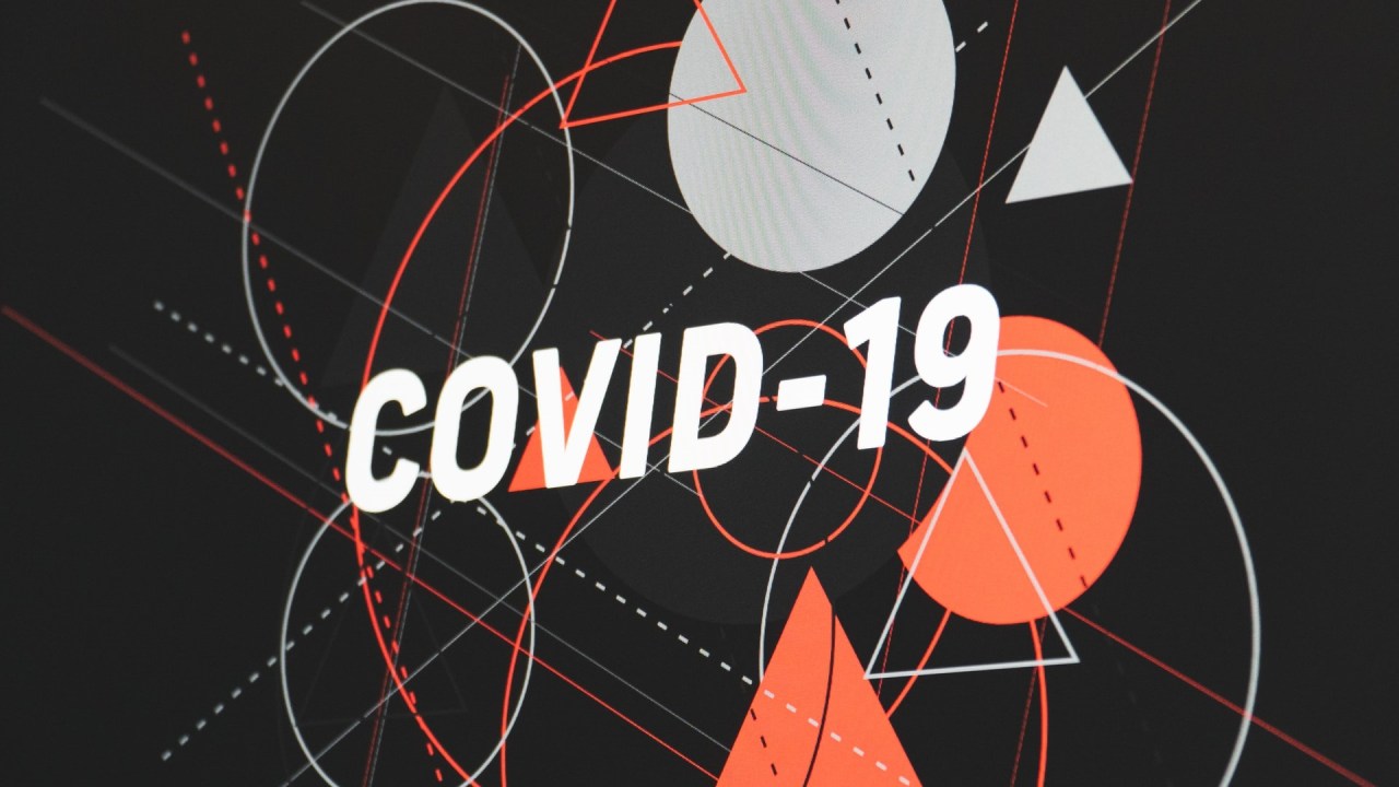 COVID-19 overlaid on top of various circles and triangles, dotted and solid lines.